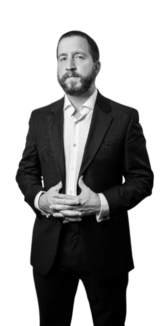Professional headshot of Jon Manley in a black suit, Stop Touching Base branding